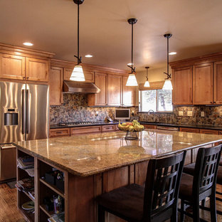 Traditional kitchen in Denver with stainless steel appliances and slate splashback.