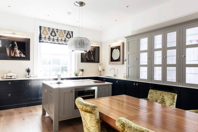 Inspiration for a modern kitchen in Gloucestershire with shaker cabinets and an island.