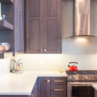 Inspiration for a modern l-shaped open plan kitchen in Salt Lake City with shaker cabinets, grey cabinets, stainless steel appliances, with island, an undermount sink, granite benchtops, white splashback, light hardwood floors and beige floor.