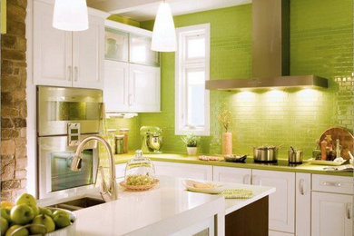 Example of a mid-sized trendy u-shaped linoleum floor and beige floor eat-in kitchen design in Other with an undermount sink, shaker cabinets, dark wood cabinets, concrete countertops, green backsplash, glass tile backsplash, stainless steel appliances and an island