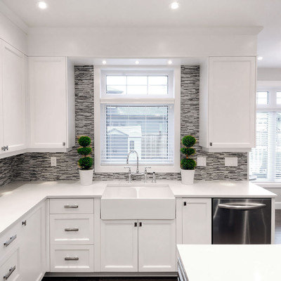 Transitional eat-in kitchen photo in Other with glass-front cabinets, a farmhouse sink, multicolored backsplash, matchstick tile backsplash and stainless steel appliances