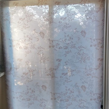 Patterned roller blind on a patio door in a cozy Etobicoke home
