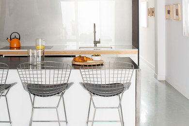 Trendy kitchen photo in Toronto with white backsplash and glass sheet backsplash