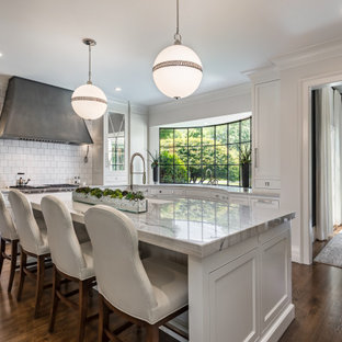 Large transitional enclosed kitchen inspiration - Large transitional u-shaped dark wood floor and brown floor enclosed kitchen photo in Other with white cabinets, white backsplash, an island, gray countertops, an undermount sink, recessed-panel cabinets, marble countertops, ceramic backsplash and stainless steel appliances