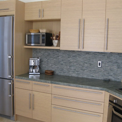 Eat-in kitchen - mid-sized contemporary l-shaped ceramic tile eat-in kitchen idea in San Diego with a single-bowl sink, flat-panel cabinets, light wood cabinets, granite countertops, multicolored backsplash, mosaic tile backsplash, paneled appliances and no island
