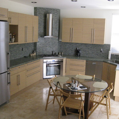 Inspiration for a mid-sized contemporary l-shaped ceramic tile eat-in kitchen remodel in San Diego with a single-bowl sink, flat-panel cabinets, light wood cabinets, granite countertops, multicolored backsplash, mosaic tile backsplash, paneled appliances and no island