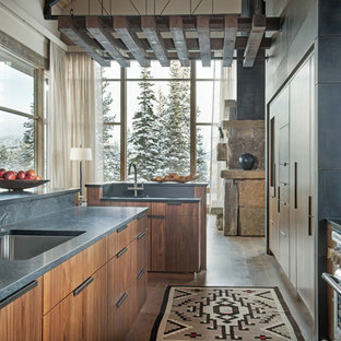 Rustic open concept kitchen designs - Inspiration for a rustic galley dark wood floor and brown floor open concept kitchen remodel in Other with an undermount sink, flat-panel cabinets, medium tone wood cabinets and an island