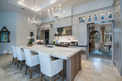 Eat-in kitchen - mid-sized transitional l-shaped travertine floor and beige floor eat-in kitchen idea in Miami with an undermount sink, shaker cabinets, gray cabinets, marble countertops, multicolored backsplash, marble backsplash, stainless steel appliances and an island