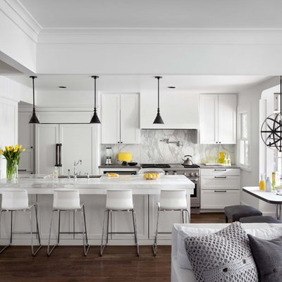 Open concept kitchen - traditional galley open concept kitchen idea in Austin with paneled appliances, white cabinets, marble countertops, white backsplash, stone slab backsplash and recessed-panel cabinets