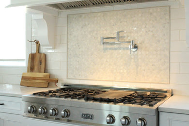 Example of a kitchen design in Indianapolis with marble backsplash