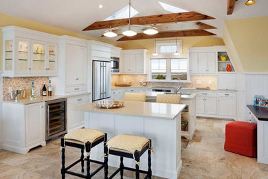 Transitional travertine floor kitchen photo in Boston with an undermount sink, beaded inset cabinets, white cabinets, granite countertops, multicolored backsplash, mosaic tile backsplash and stainless steel appliances