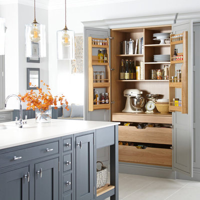 Example of a country kitchen design in Other with a single-bowl sink, shaker cabinets, gray cabinets and an island
