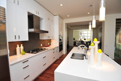 This is an example of a contemporary kitchen in Calgary with stainless steel appliances.