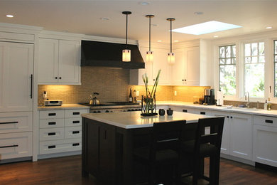 Kitchen - huge transitional kitchen idea in San Francisco with white cabinets and beige backsplash