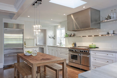 Inspiration for a transitional kitchen remodel in San Francisco with white cabinets, white backsplash, subway tile backsplash, stainless steel appliances and shaker cabinets