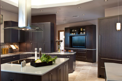 Example of a trendy kitchen design in Phoenix with flat-panel cabinets, dark wood cabinets and granite countertops