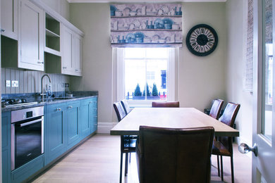 This is an example of a kitchen in Surrey.