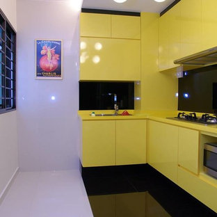 Photo of a modern l-shaped separate kitchen in Singapore with a drop-in sink, marble floors and no island.
