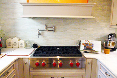 Example of a classic eat-in kitchen design in Philadelphia with a farmhouse sink, beaded inset cabinets, white cabinets, marble countertops, white backsplash, marble backsplash and stainless steel appliances