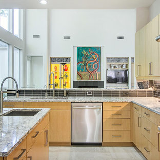 Design ideas for a mid-sized midcentury u-shaped separate kitchen in Dallas with an undermount sink, flat-panel cabinets, light wood cabinets, quartz benchtops, black splashback, ceramic splashback, stainless steel appliances, porcelain floors and multiple islands.