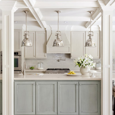 Mid-sized transitional kitchen photo in Little Rock with stainless steel appliances, subway tile backsplash, recessed-panel cabinets, blue cabinets, white backsplash, an undermount sink, quartz countertops and an island