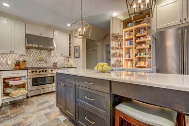 Elegant galley eat-in kitchen photo in St Louis with an undermount sink, white cabinets, granite countertops and an island