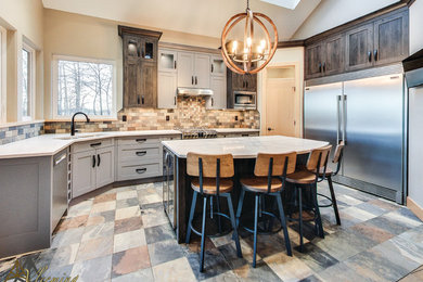Mid-sized trendy u-shaped open concept kitchen photo in San Diego with a double-bowl sink, shaker cabinets, gray cabinets, solid surface countertops, multicolored backsplash, stone tile backsplash, stainless steel appliances and an island