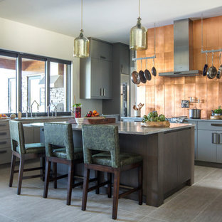 Large contemporary eat-in kitchen ideas - Large trendy l-shaped porcelain tile and gray floor eat-in kitchen photo in Jacksonville with flat-panel cabinets, gray cabinets, marble countertops, metallic backsplash, stainless steel appliances, an island, gray countertops and metal backsplash