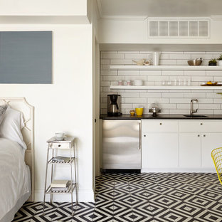 Small transitional kitchen designs - Inspiration for a small transitional single-wall multicolored floor kitchen remodel in Nashville with a single-bowl sink, open cabinets, white backsplash, subway tile backsplash and stainless steel appliances