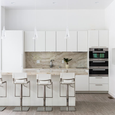 Trendy light wood floor kitchen photo in Boston with flat-panel cabinets, white cabinets, an island and marble backsplash