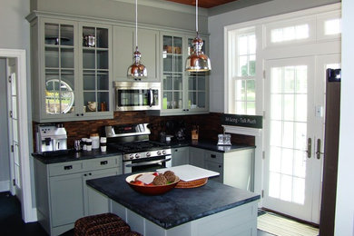 Eat-in kitchen - small transitional single-wall porcelain tile eat-in kitchen idea in New York with an undermount sink, shaker cabinets, gray cabinets, soapstone countertops, brown backsplash, matchstick tile backsplash, stainless steel appliances and an island