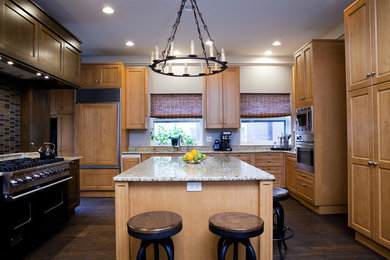 Example of a trendy u-shaped medium tone wood floor open concept kitchen design in Chicago with shaker cabinets, light wood cabinets, multicolored backsplash, paneled appliances and an island