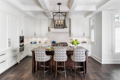 Eat-in kitchen - large transitional l-shaped dark wood floor eat-in kitchen idea in Toronto with white cabinets, granite countertops, stainless steel appliances, an island, white backsplash, a farmhouse sink, shaker cabinets and mosaic tile backsplash