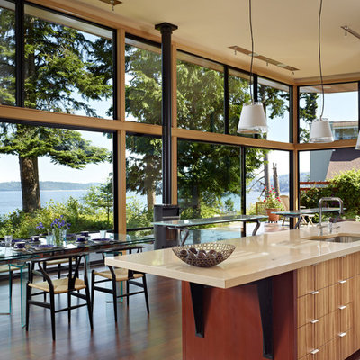 Inspiration for a modern eat-in kitchen remodel in Seattle with a single-bowl sink, flat-panel cabinets, medium tone wood cabinets and quartz countertops