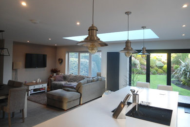 Contemporary kitchen in Cheshire with an island.