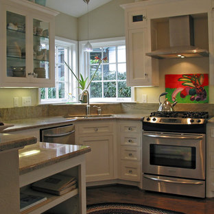 This is an example of a small traditional u-shaped eat-in kitchen in Dallas with an undermount sink, beaded inset cabinets, white cabinets, granite benchtops, beige splashback, stainless steel appliances, dark hardwood floors, no island, brown floor, beige benchtop and granite splashback.