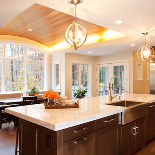Inspiration for a transitional kitchen remodel in DC Metro with stainless steel appliances, a farmhouse sink and quartzite countertops