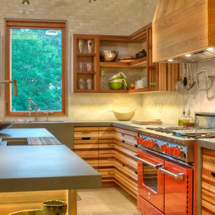 Mid-sized country l-shaped open plan kitchen in Tampa with an integrated sink, open cabinets, medium wood cabinets, concrete benchtops, coloured appliances, white splashback, ceramic splashback, concrete floors and with island.