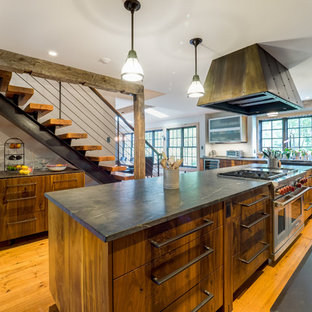Mid-sized rustic enclosed kitchen pictures - Enclosed kitchen - mid-sized rustic galley medium tone wood floor and brown floor enclosed kitchen idea in Philadelphia with open cabinets, medium tone wood cabinets, soapstone countertops, white backsplash, stainless steel appliances and an island