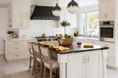 Example of a large classic u-shaped porcelain tile and gray floor eat-in kitchen design in Philadelphia with a farmhouse sink, beaded inset cabinets, gray cabinets, quartzite countertops, white backsplash, subway tile backsplash, colored appliances, an island and white countertops