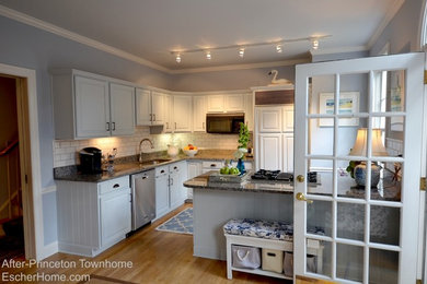 Design ideas for a small classic l-shaped kitchen/diner in New York with a submerged sink, raised-panel cabinets, granite worktops, white splashback, ceramic splashback, stainless steel appliances, medium hardwood flooring and a breakfast bar.