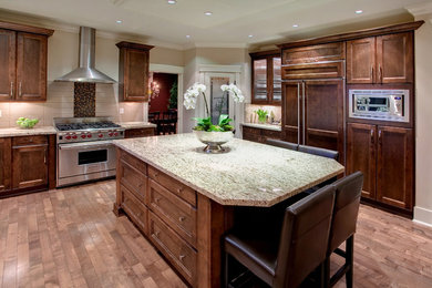 Example of a trendy kitchen design in Vancouver with paneled appliances