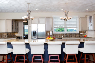 Large single-wall eat-in kitchen photo in Other with white cabinets, granite countertops, brown backsplash, mosaic tile backsplash, stainless steel appliances and an island