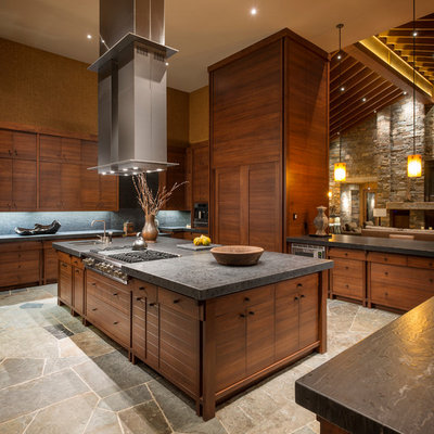 Example of a mountain style u-shaped open concept kitchen design in Seattle with flat-panel cabinets, medium tone wood cabinets, gray backsplash and slate backsplash