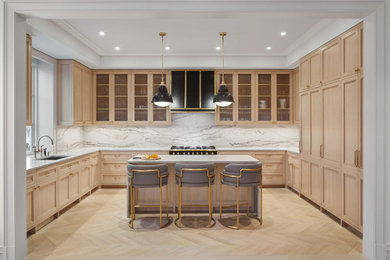 Inspiration for a large transitional u-shaped beige floor and coffered ceiling open concept kitchen remodel in New York with recessed-panel cabinets, light wood cabinets, quartzite countertops, white backsplash, stone slab backsplash, an island and white countertops
