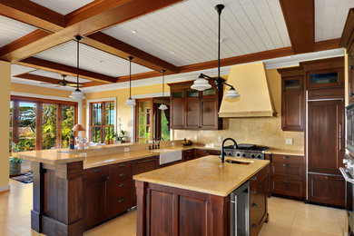 Example of a classic kitchen design in Hawaii with paneled appliances