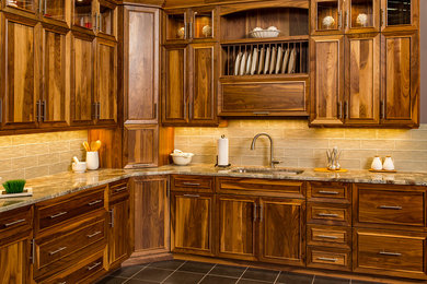 Trendy kitchen photo in Other with an undermount sink, medium tone wood cabinets, granite countertops, beige backsplash and glass tile backsplash