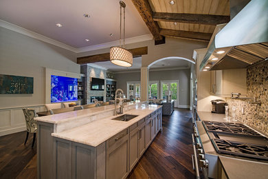 Open concept kitchen - transitional l-shaped dark wood floor open concept kitchen idea in Miami with an island