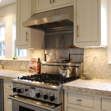 Professional 30" stove, stainless steel and granite backsplash