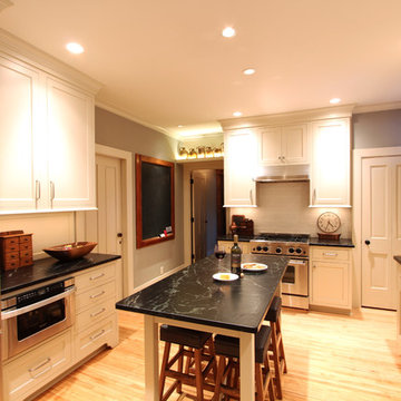 Professional Range in Farmhouse Kitchen with Inset Cabinets